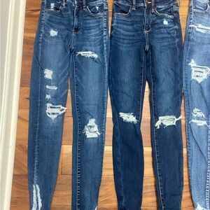 (4) pair American Eagle jeans. 2 pair women’s size 00/ 2 pair women’s size 000